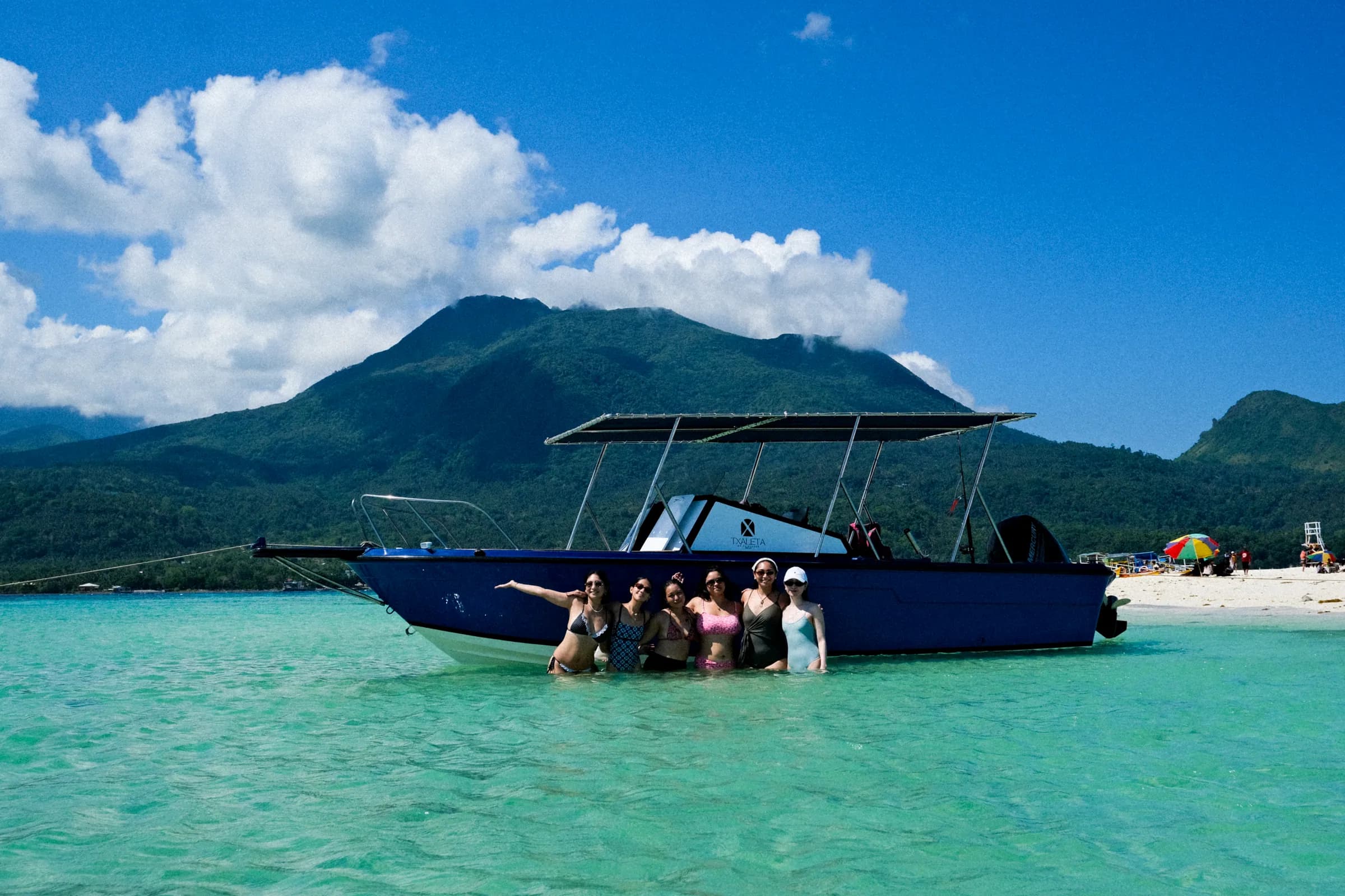 A group of guests beside the Txaleta boat at White Island