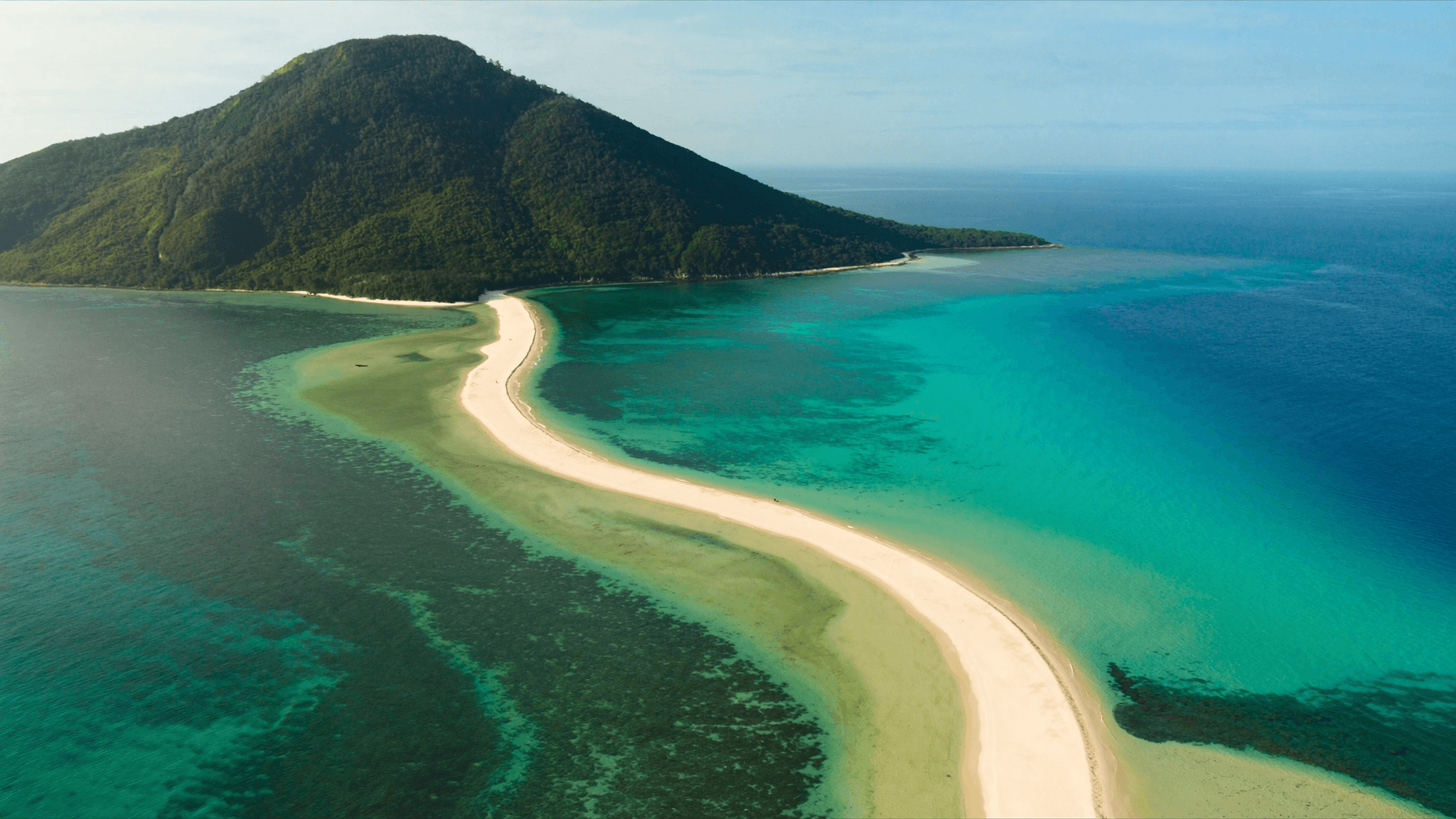 Camiguin itinerary: White Island sandbar at sunrise with the volcano behind it